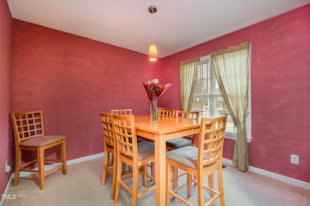 view of carpeted dining area