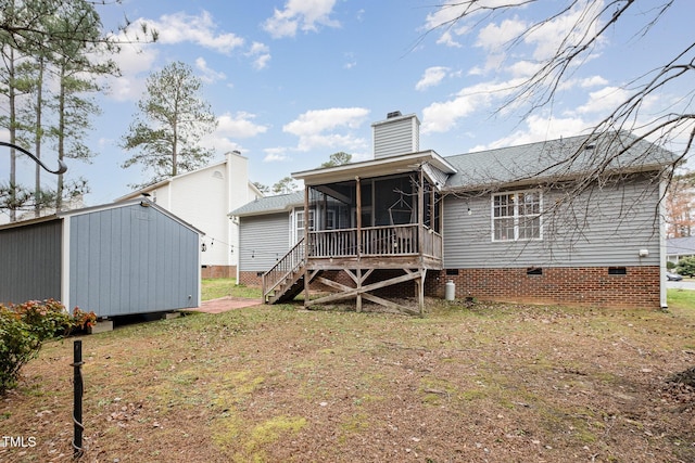 back of property with a sunroom and a lawn