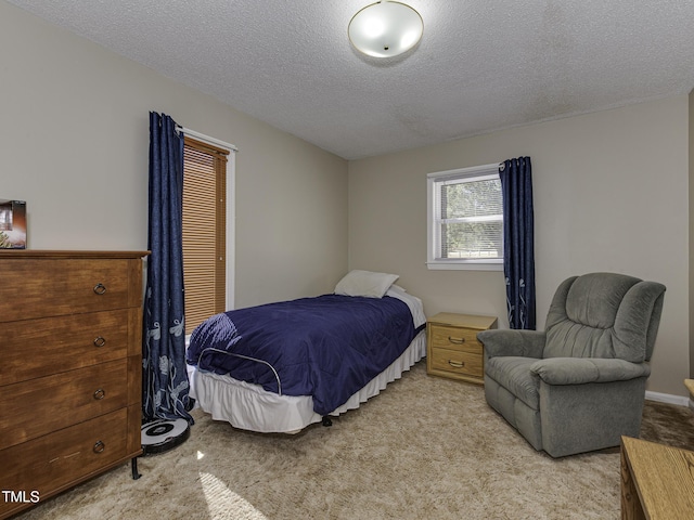 carpeted bedroom with a textured ceiling