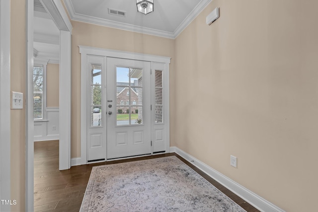 foyer entrance featuring crown molding and dark wood-type flooring