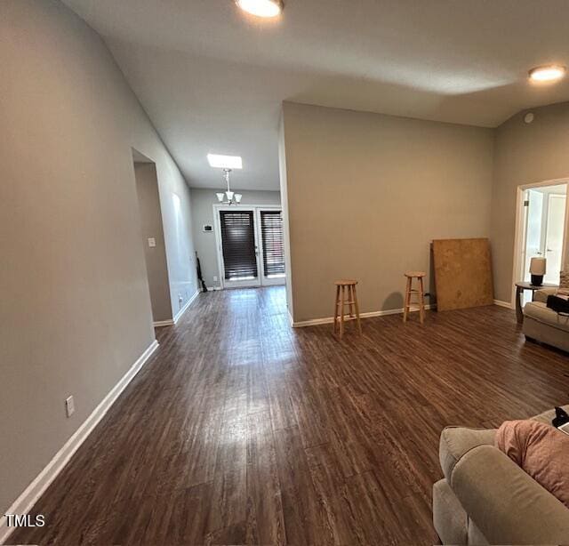 unfurnished living room with dark hardwood / wood-style floors