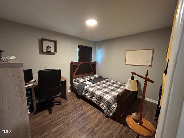 bedroom featuring dark hardwood / wood-style floors