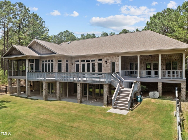 back of house with a yard, a patio, and a deck