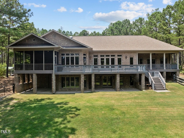 back of house with a patio area, a sunroom, a yard, and a deck