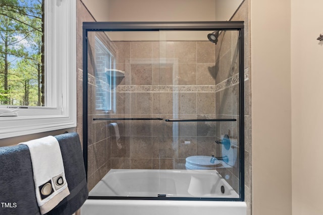 bathroom featuring enclosed tub / shower combo