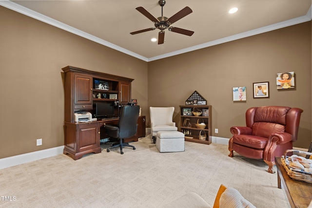 carpeted office space with ceiling fan and ornamental molding