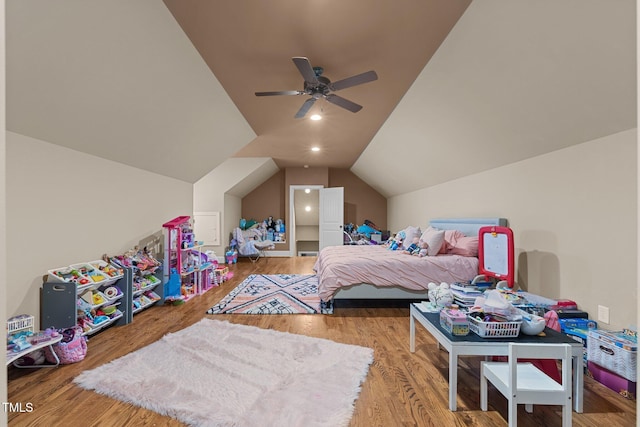 bedroom featuring ceiling fan, wood-type flooring, and vaulted ceiling