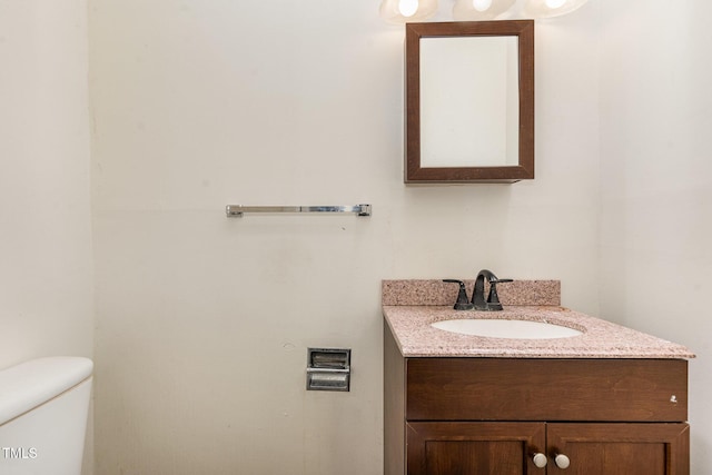 bathroom with toilet and vanity