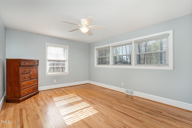 unfurnished bedroom featuring ceiling fan and light hardwood / wood-style flooring