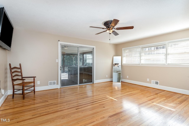 unfurnished living room with light hardwood / wood-style floors and ceiling fan