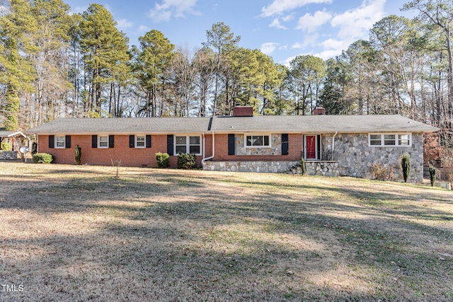 ranch-style home with a front lawn