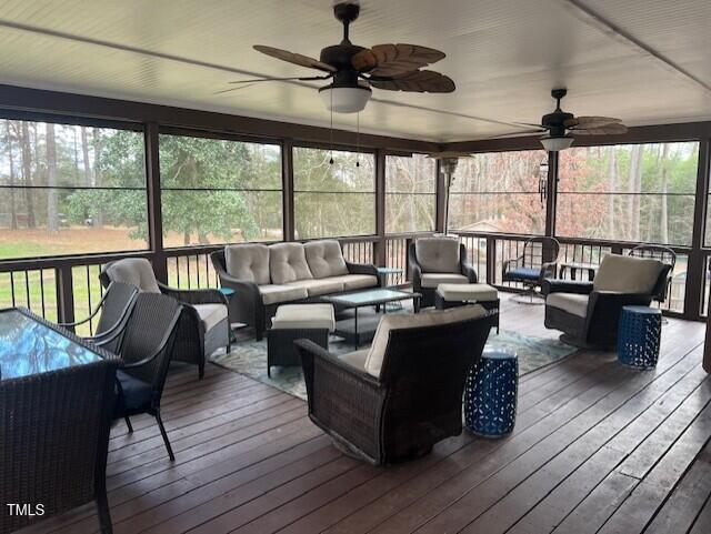 sunroom / solarium with ceiling fan