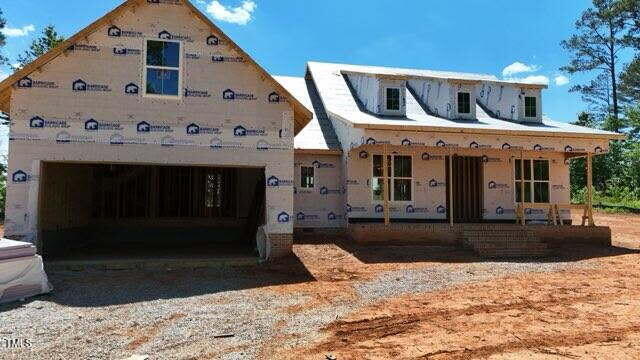 2850 Sheep Pasture Rd, Spring Hope, NC 27882 - property in mid-construction featuring a porch, driveway, and a garage
