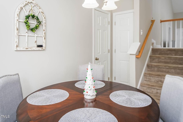 dining space featuring a chandelier