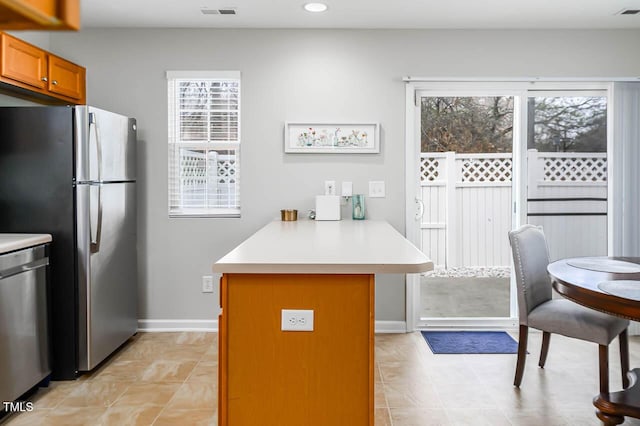 kitchen with kitchen peninsula and appliances with stainless steel finishes