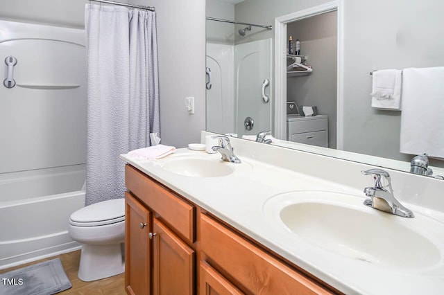 full bathroom with vanity, tile patterned flooring, toilet, independent washer and dryer, and shower / tub combo with curtain