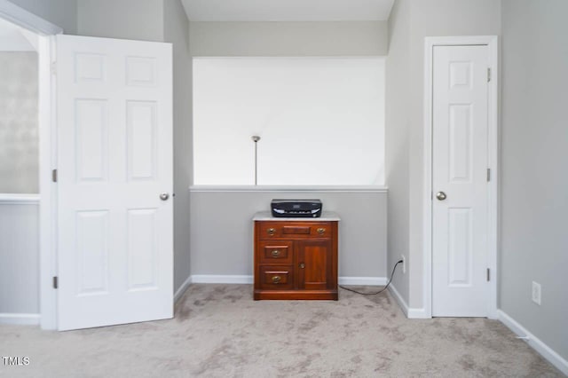 unfurnished bedroom featuring light colored carpet