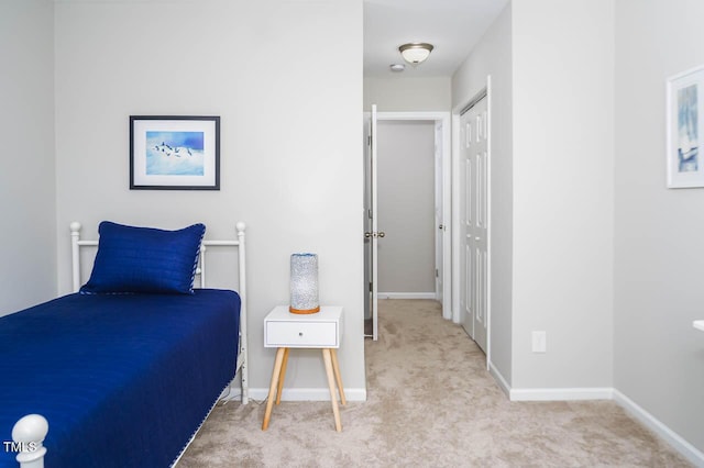 bedroom with light colored carpet