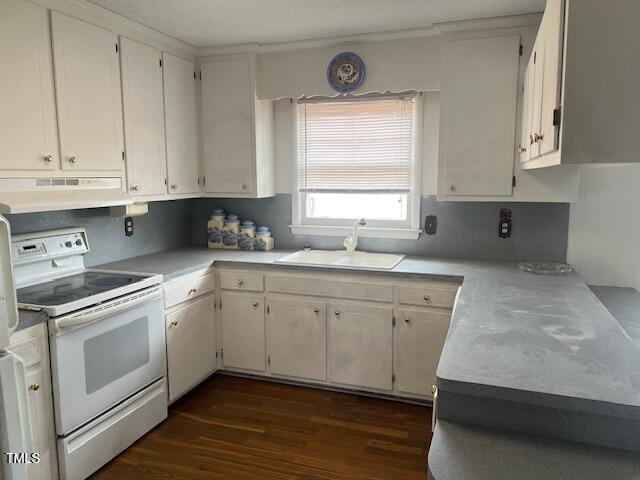 kitchen featuring white electric range, dark hardwood / wood-style flooring, sink, and white cabinetry