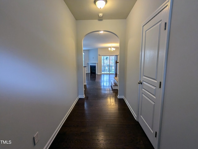 hallway with dark hardwood / wood-style floors