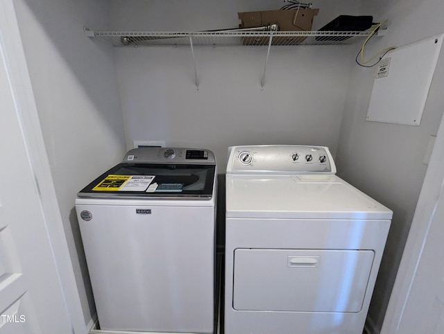 laundry area with independent washer and dryer