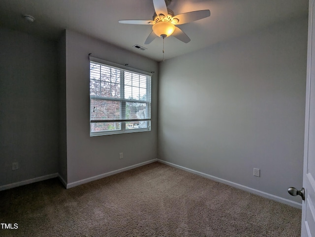 empty room with carpet flooring and ceiling fan