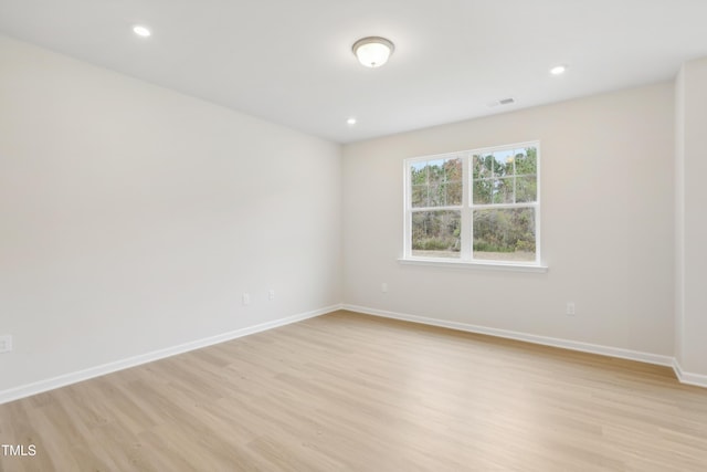 spare room featuring light wood-type flooring