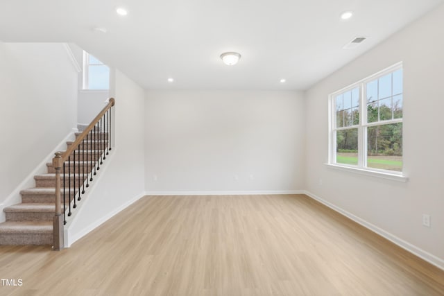 spare room with light hardwood / wood-style flooring