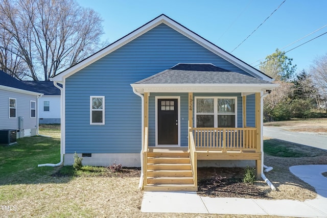 bungalow-style house with a front lawn, cooling unit, and a porch