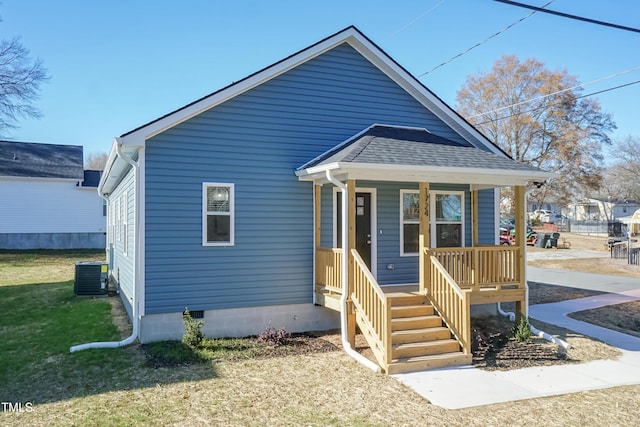 bungalow-style home featuring central AC unit and covered porch