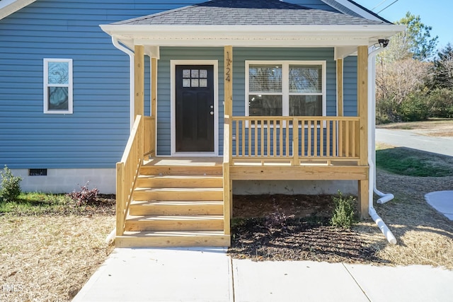 view of exterior entry with covered porch