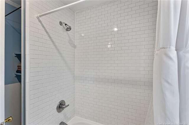 bathroom with shower / bath combination with curtain