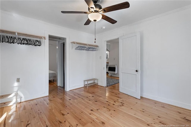 unfurnished room with crown molding, ceiling fan, and wood-type flooring