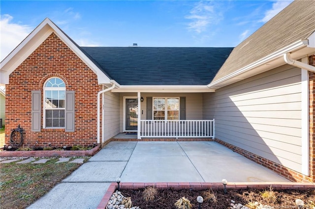 doorway to property with covered porch