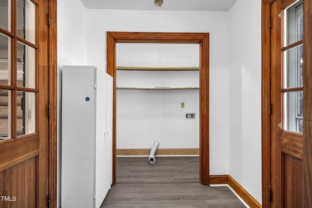 corridor with dark hardwood / wood-style floors