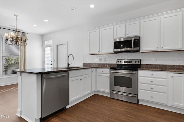 kitchen featuring sink, white cabinetry, and stainless steel appliances