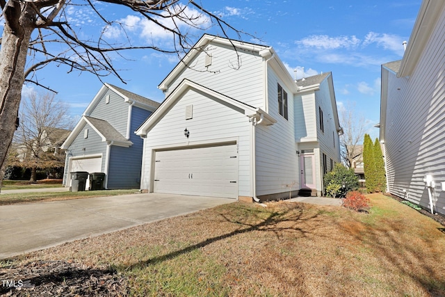 view of property exterior featuring a yard and a garage