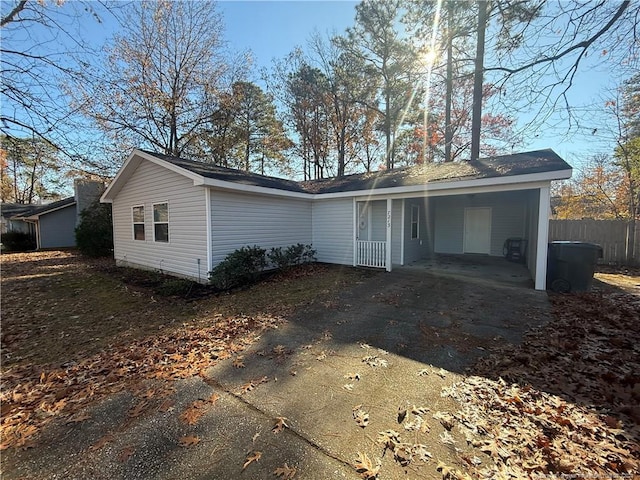 exterior space featuring a carport