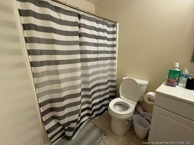 bathroom with tile patterned floors, vanity, and toilet