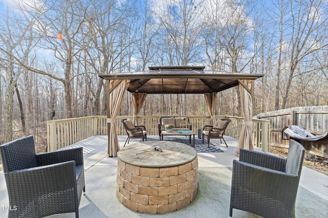 view of patio / terrace with a gazebo and an outdoor living space with a fire pit