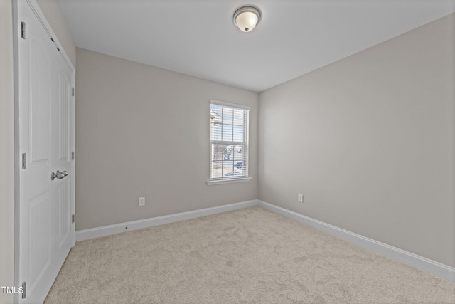 unfurnished bedroom with light carpet