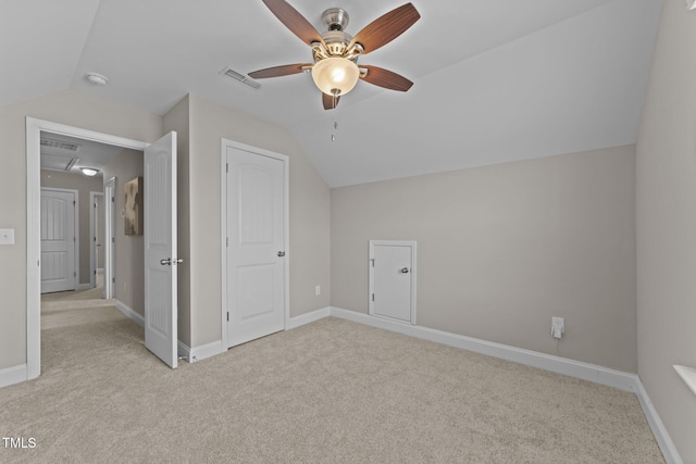 bonus room featuring ceiling fan, light colored carpet, and lofted ceiling