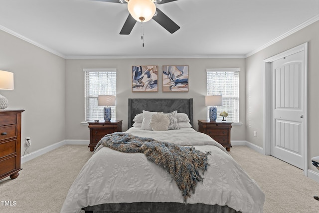 carpeted bedroom with crown molding and ceiling fan