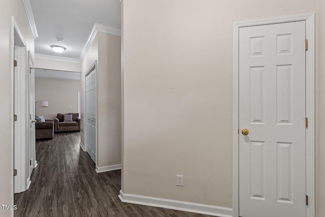 hall featuring dark hardwood / wood-style floors and ornamental molding