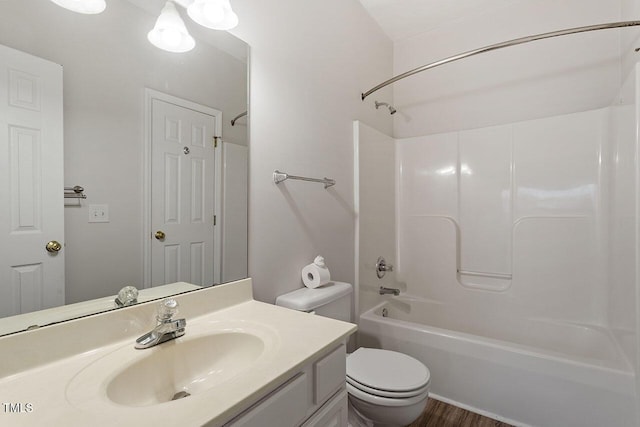 full bathroom featuring hardwood / wood-style flooring, vanity, toilet, and shower / bath combination