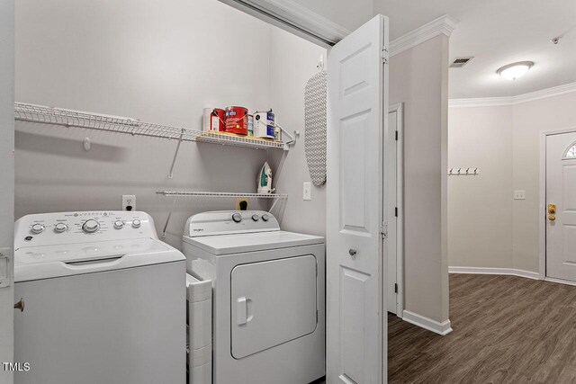 524 Glenolden Ct, Cary, NC 27513 - laundry area with washer and clothes dryer, dark wood-type flooring, and ornamental molding