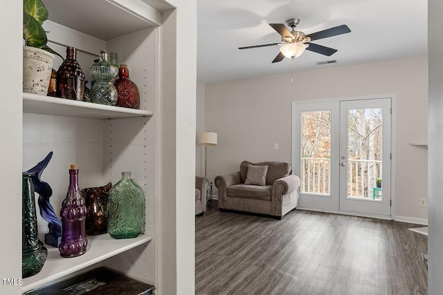 sitting room with hardwood / wood-style flooring, ceiling fan, and french doors
