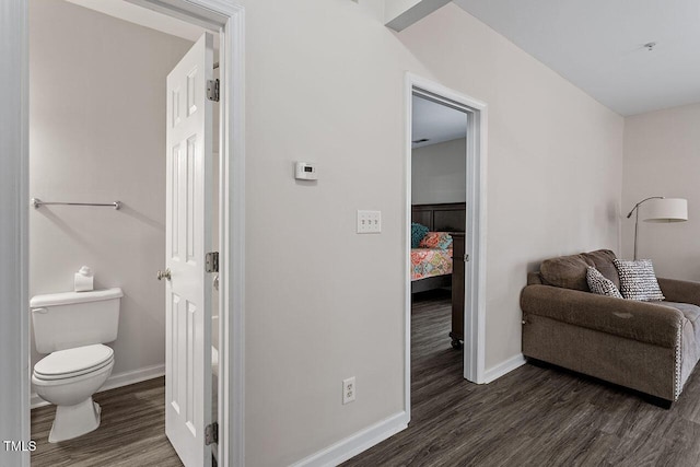 interior space featuring hardwood / wood-style flooring and toilet