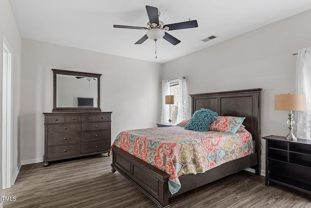 bedroom featuring dark hardwood / wood-style flooring and ceiling fan