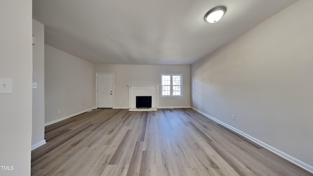 unfurnished living room with light hardwood / wood-style floors